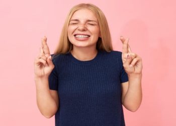 woman smiles and shows hot to straighten teeth without braces