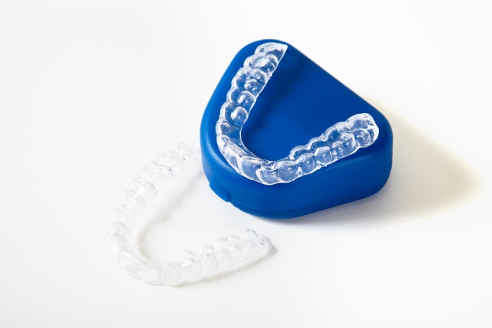 Photo of a clear retainer on a white surface